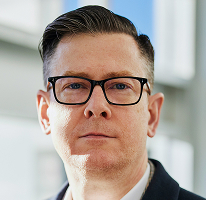 暗号資産取引会社の経営幹部であるAlexander Hughes CEOのポートレート